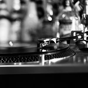 A picture of a turntable and bottles